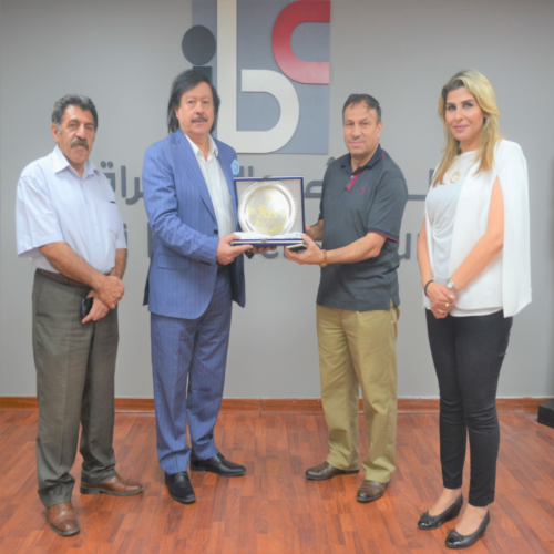 Iraqi Artist Hamid Ruweid presents IBC with a Distinctive Work of Art during his visit to IBC Offices
